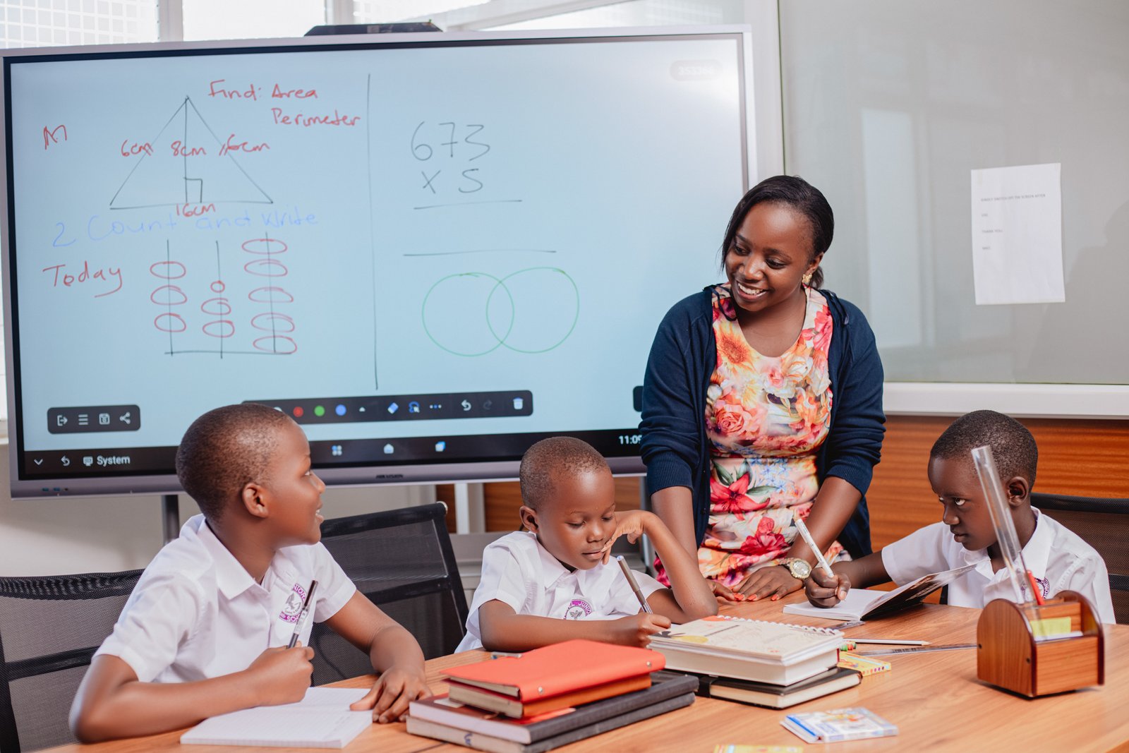 Teacher instructing pupils at Astel Junior School
